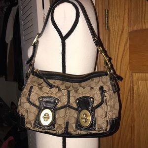 Signature Coach Medium Legacy Flap Shoulder Bag.